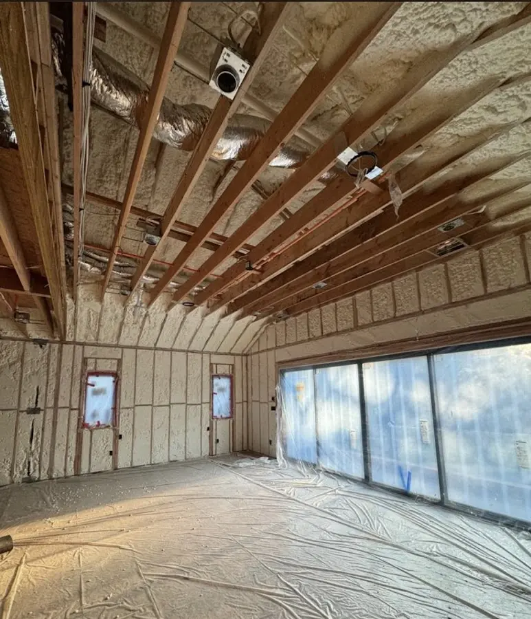 Interior walls and ceiling insulated with spray foam during new construction in Capitol View